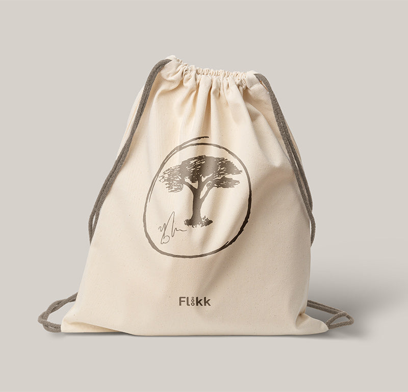 Beige tøybag med Flåkk-logo.